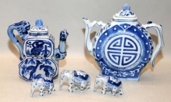 2 x decorative Oriental blue and white china teapots c/w 3 x small blue and white china elephants.