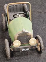 Vintage metal children's green pedal car 80cm in length.