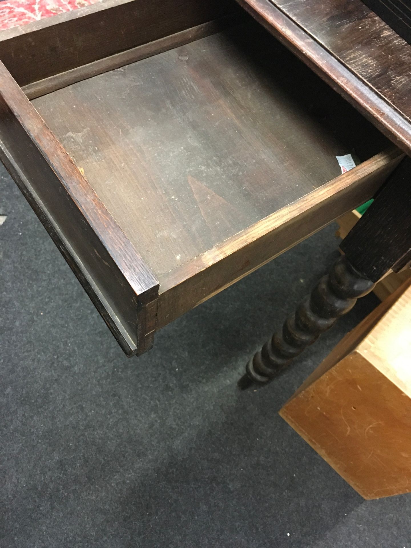 Oak stained hall table set on turned supports with carved under and back tray, having secret draws - Image 4 of 4