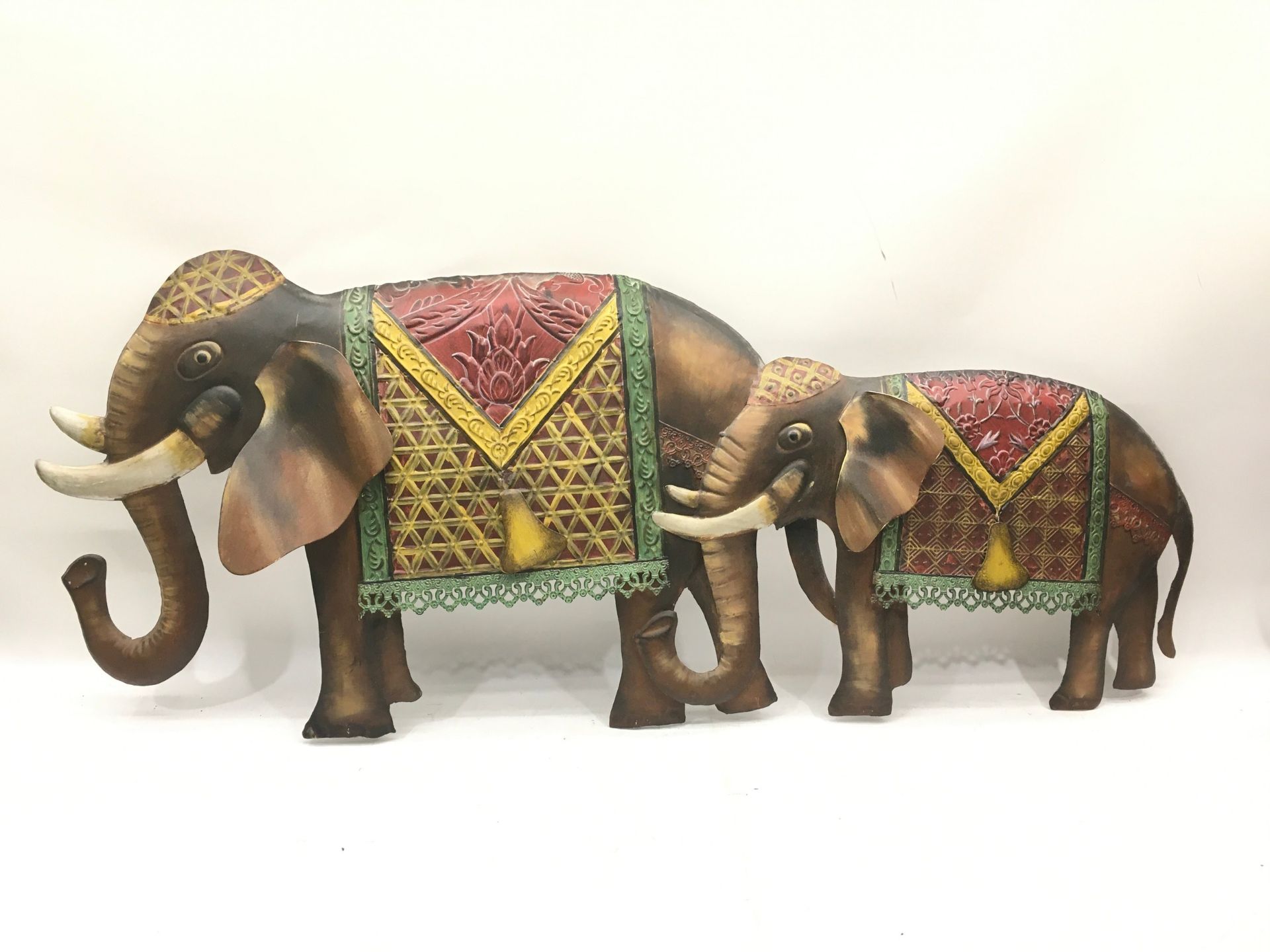 A metal work elephant wall hanging.