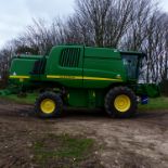 2011 JOHN DEERE T550 COMBINE WITH 22FT HEADER AND HEADER CARRIER, C/W STRAW CHOPPER. REG VU11 AXZ.