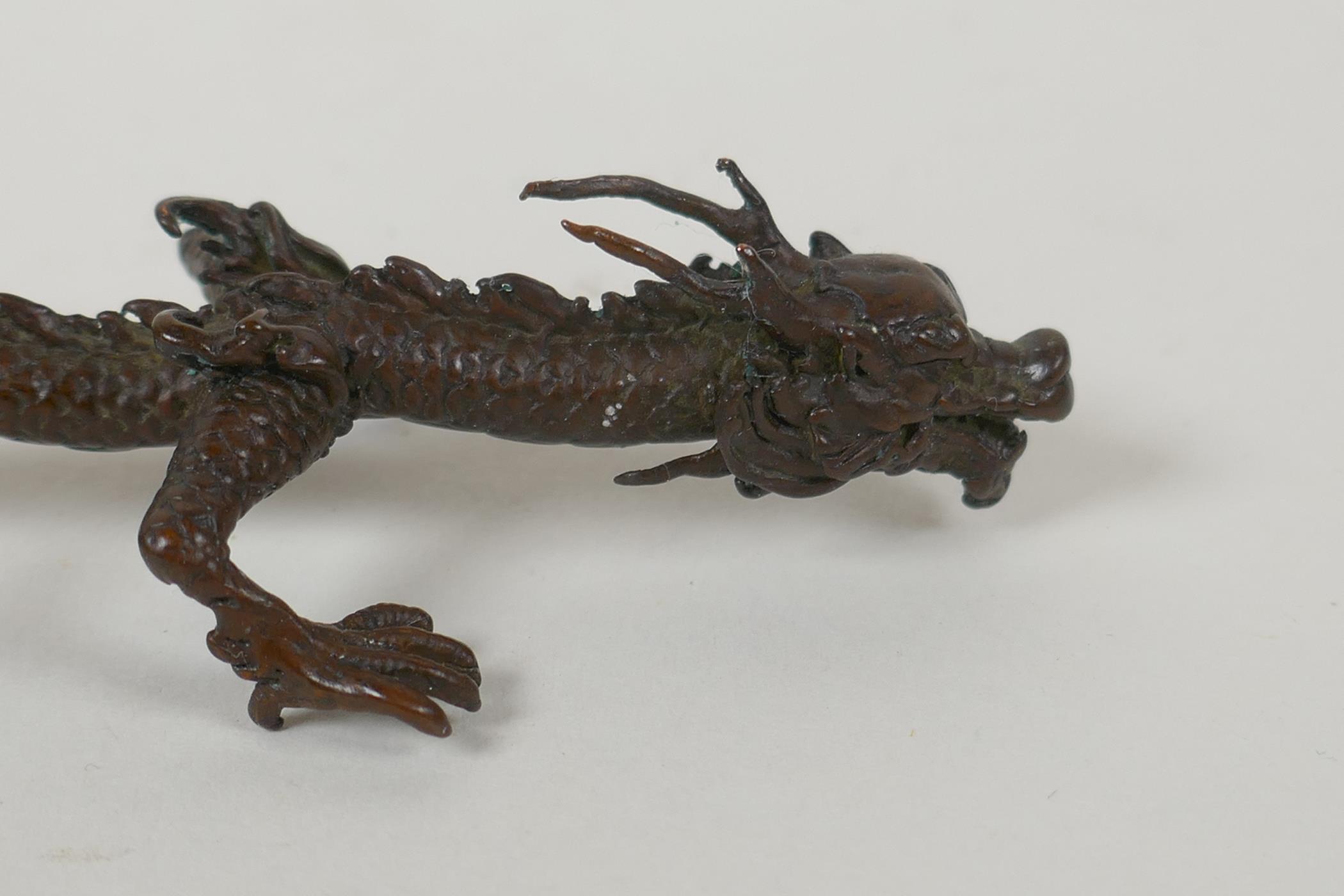 A Japanese style bronze okimono dragon, 16cm long - Image 2 of 3