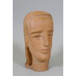 A terracotta sculpture of a female head, inscribed monogram to base, 28cm high