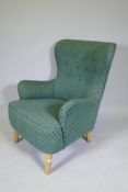 Theo Ruth, mid century armchair, raised on beechwood supports, stamped 'K', with good upholstery