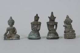 Four Eastern bronze miniature Buddhivistic figures, 5cm high