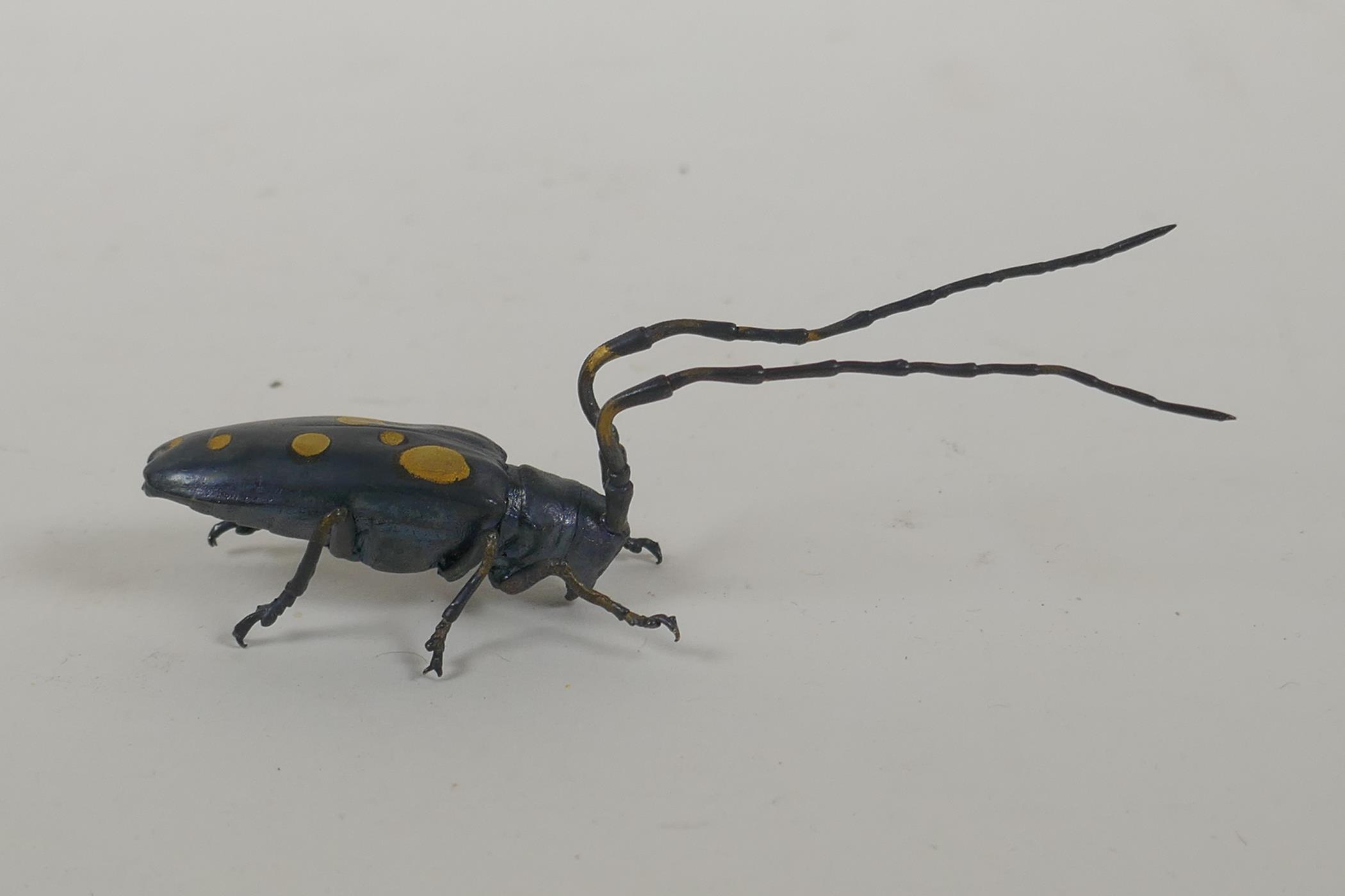 A Japanese style bronze okimono longhorn beetle