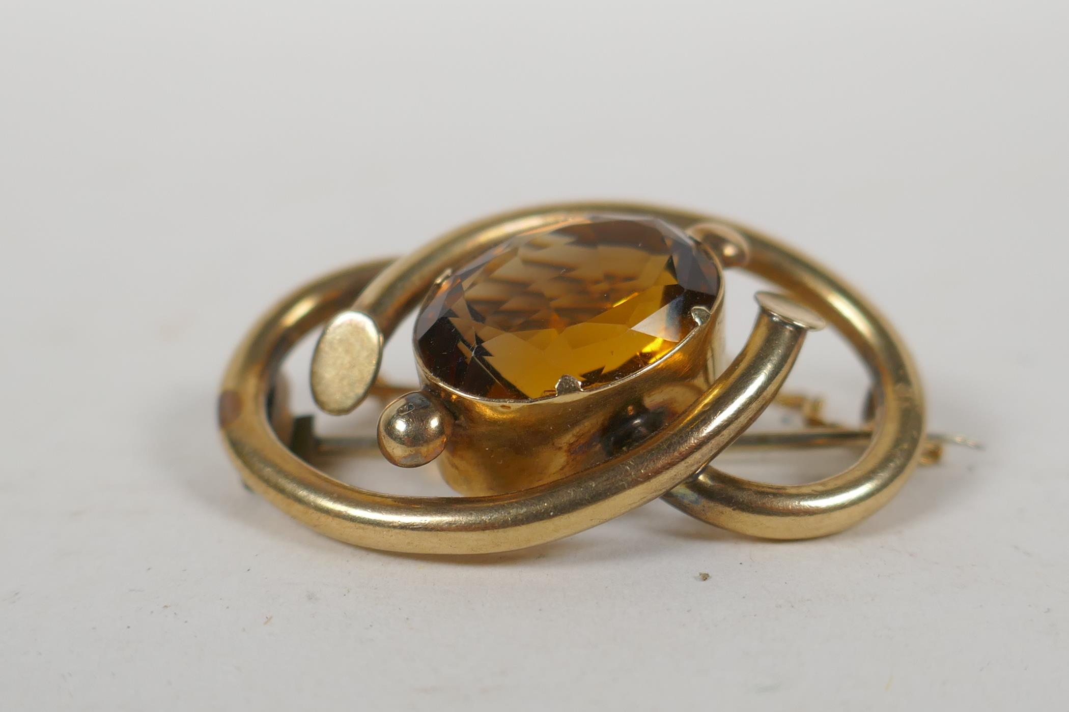 An antique yellow metal brooch set with a large citrine stone, 11g groos - Image 2 of 3