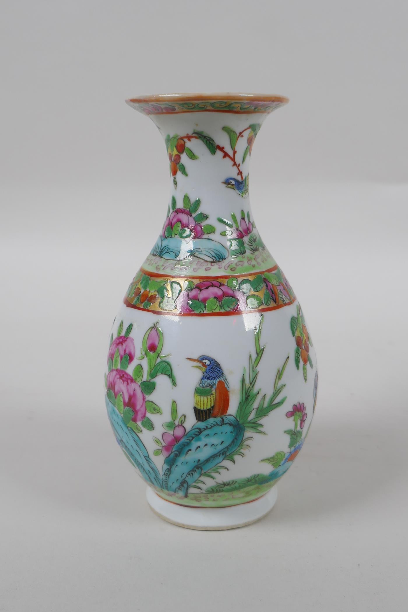 A late C19th Cantonese famille vert porcelain vase decorated with birds and butterflies amongst