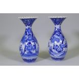 A pair of Arita blue and white vases with flared necks and frilled rims, AF repairs to necks, 45cm