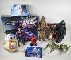 A collection of Star Wars toys, to include a chess set, action figure, starships and moneybox