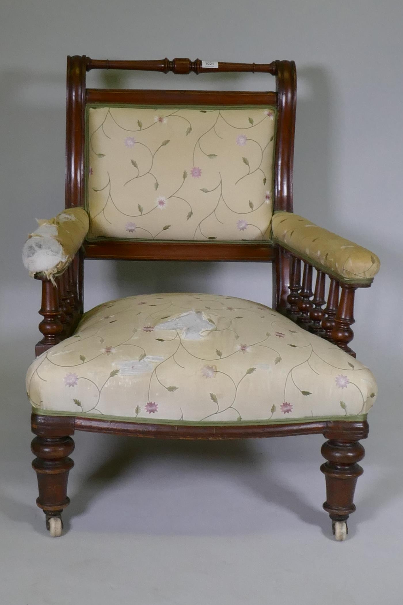 A Victorian walnut show frame easy chair, the open arms with turned spindles, raised on turned - Image 3 of 3