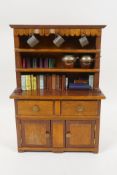 A miniature mahogany Welsh dresser and contents, 26cm high