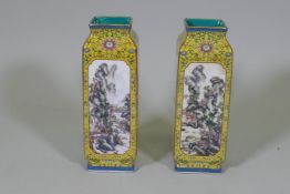A pair of Chinese yellow glazed vases, with enamelled paintings of landscapes and poems set in