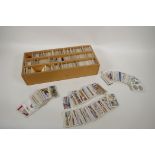 A large quantity of vintage Wills and Players cigarette cards, in a bespoke collectors box