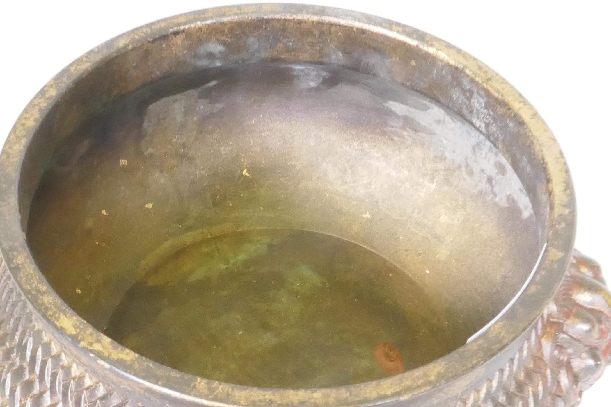 A Chinese bronze censer with mask decoration and woven basket style body, impressed seal mark to - Image 3 of 5