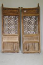 A pair of Chinese elm door panels, 50 x 140cm