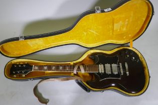 A vintage Japanese 'SG' type electric guitar and case