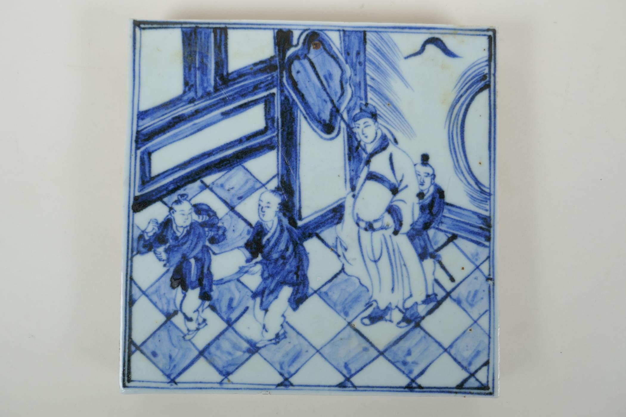 A Chinese blue and white porcelain temple tile depicting a scholar and children, 20 x 20cm