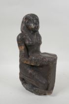 An antique Egyptian carved granite figural statue with a tray of fish, hieroglyphic inscription