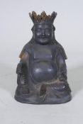 An oriental bronze Buddhivistic seated figure bearing a rosary and ruyi, 23cm high