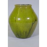 Dora Lunn, a Ravenscourt pottery vase of baluster form with mottled drip green glaze, 28cm high