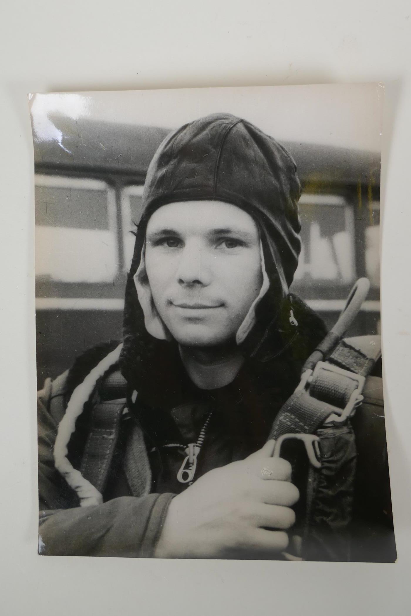Two vintage press photos of Yuri Gagarin, with archival stamps and typed Cyrillic descriptions - Image 2 of 5