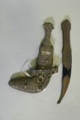 A Middle Eastern white metal/low grade silver Jambiya dagger and sheath, with filigree decoration,