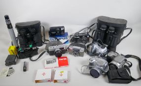 A collection of cameras and equipment, to include an Olympus PEN-EE, an Olympus Trip 35, an