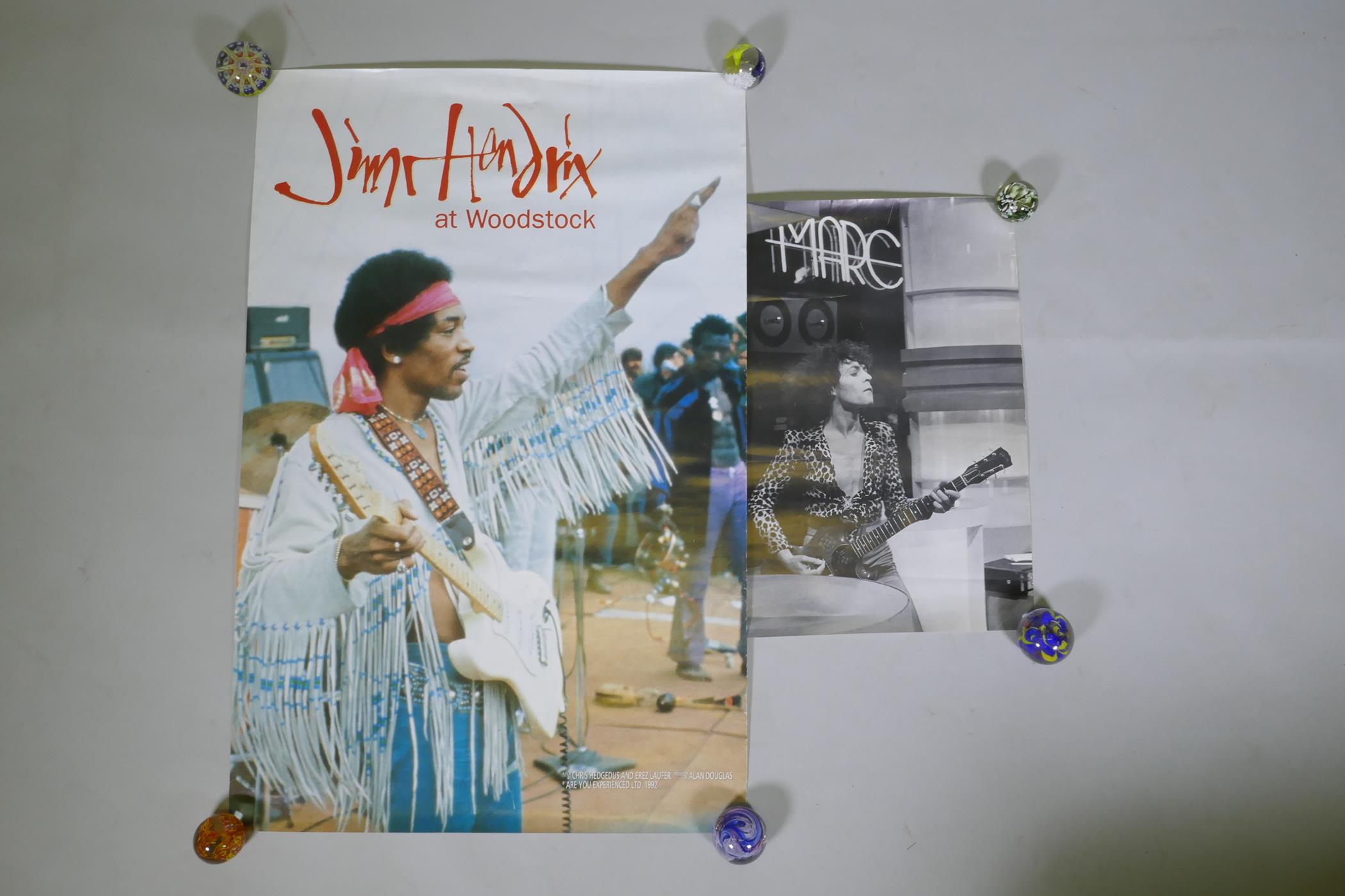 A vintage 'Jimi Hendrix at Woodstock' film poster and a poster of Mark Bolan, largest 68 x 104cm