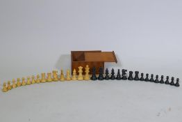 A set of weighted and ebonised carved boxwood chess pieces, king  6cm high