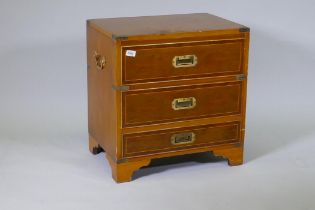 A campaign style inlaid yew wood veneered cellarette, with lift up top and fitted interior, two