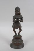 An Indian bronze figure of a woman dancing, 22cm high