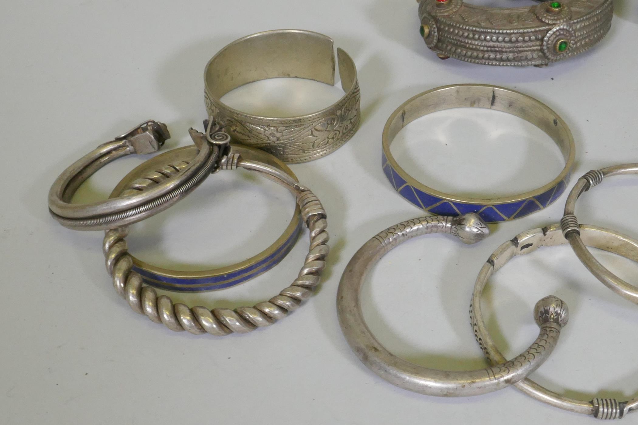 A collection of Afghan white metal bangles, set with paste stones, bidri style decoration, a Chinese - Image 3 of 6