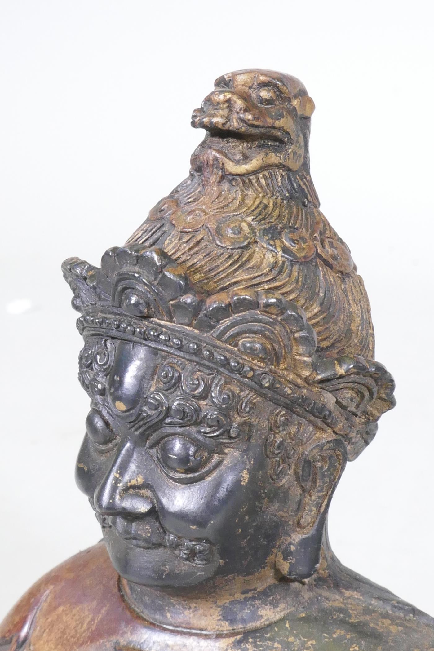 A Chinese bronze figure of an immortal, with red and gilt patination, impressed seal mark to base, - Image 7 of 7