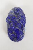 A Chinese carved lapis lazuli pendant decorated with two monkeys, 8 x 5cm