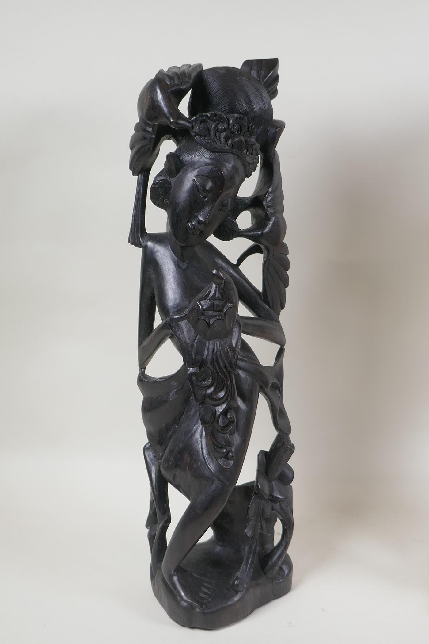 A Balinese carved hardwood figure of a dancer, and an oriental carved wood figure of a duck - Image 2 of 3