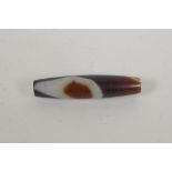 A vintage banded agate dzi bead, 6cm long