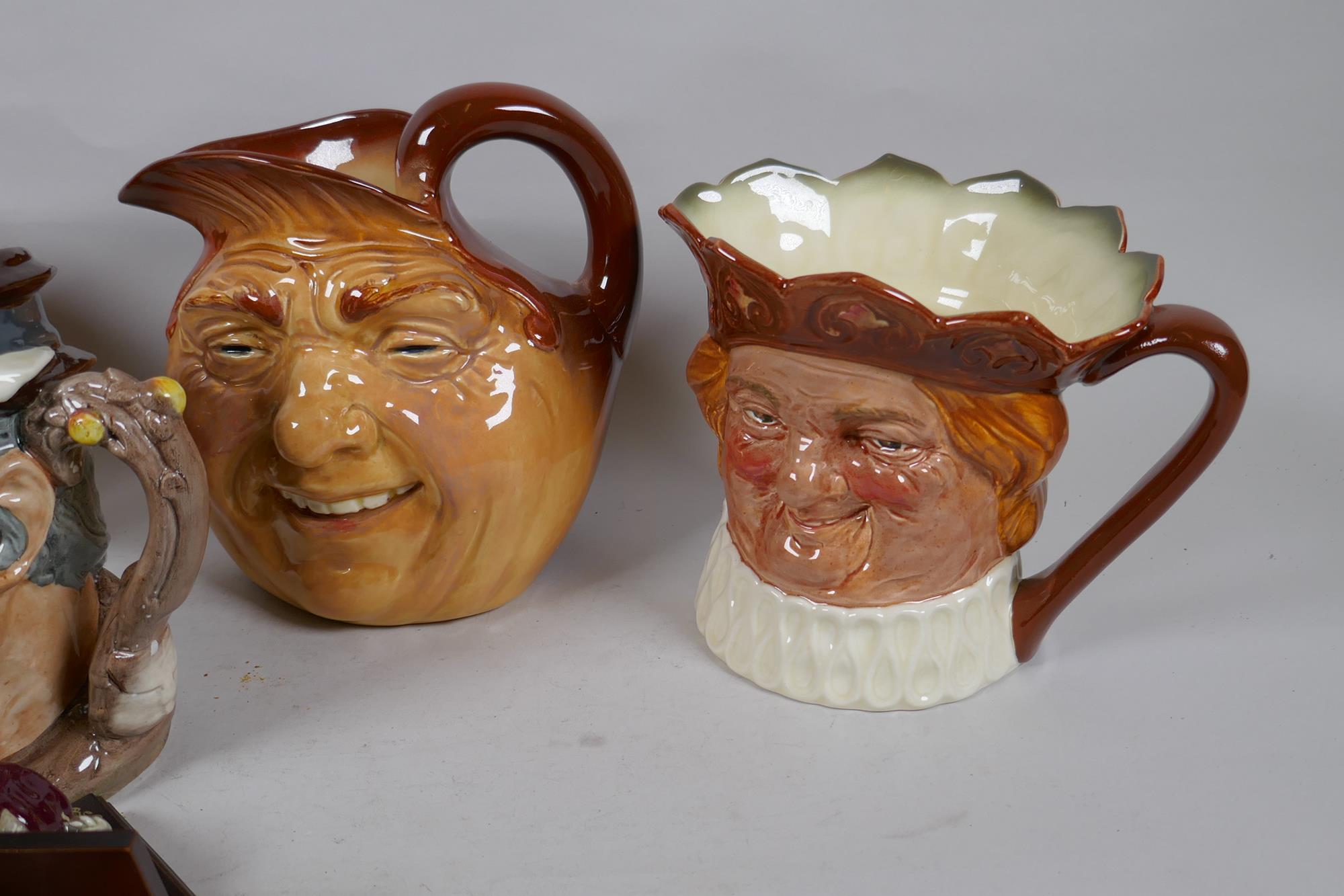 A set of six Royal Doulton mask jugs and twelve miniature jugs with display shelves - Image 2 of 6