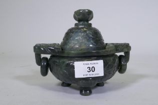 Chinese jade koro and cover with carved decoration and ring handles, 13cm high