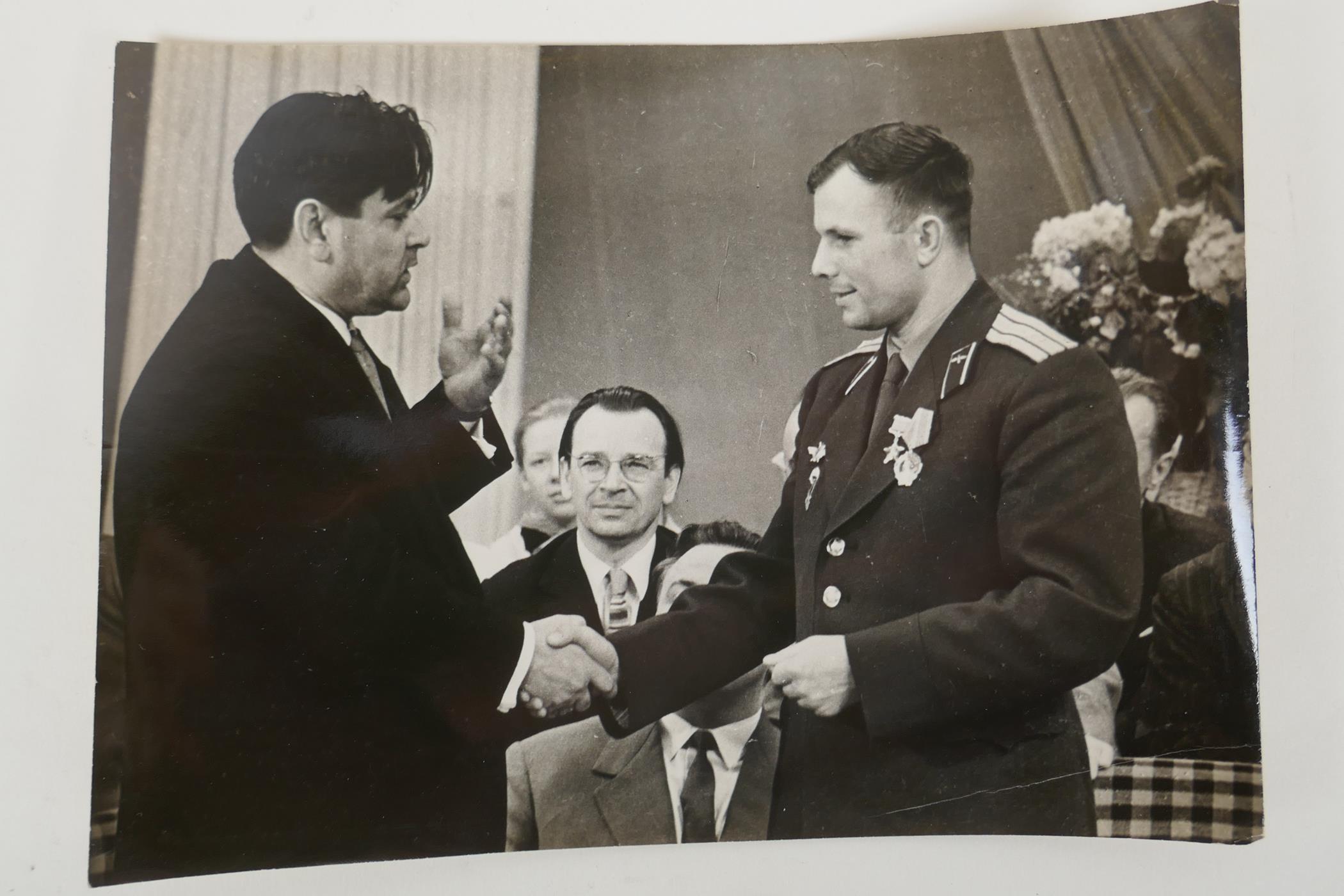 Two vintage press photos of Yuri Gagarin, with archival stamps and typed Cyrillic descriptions - Image 4 of 5