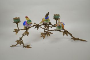 A polychrome porcelain and gilt metal candelabrum in the form of cockatoos perched on a branch,