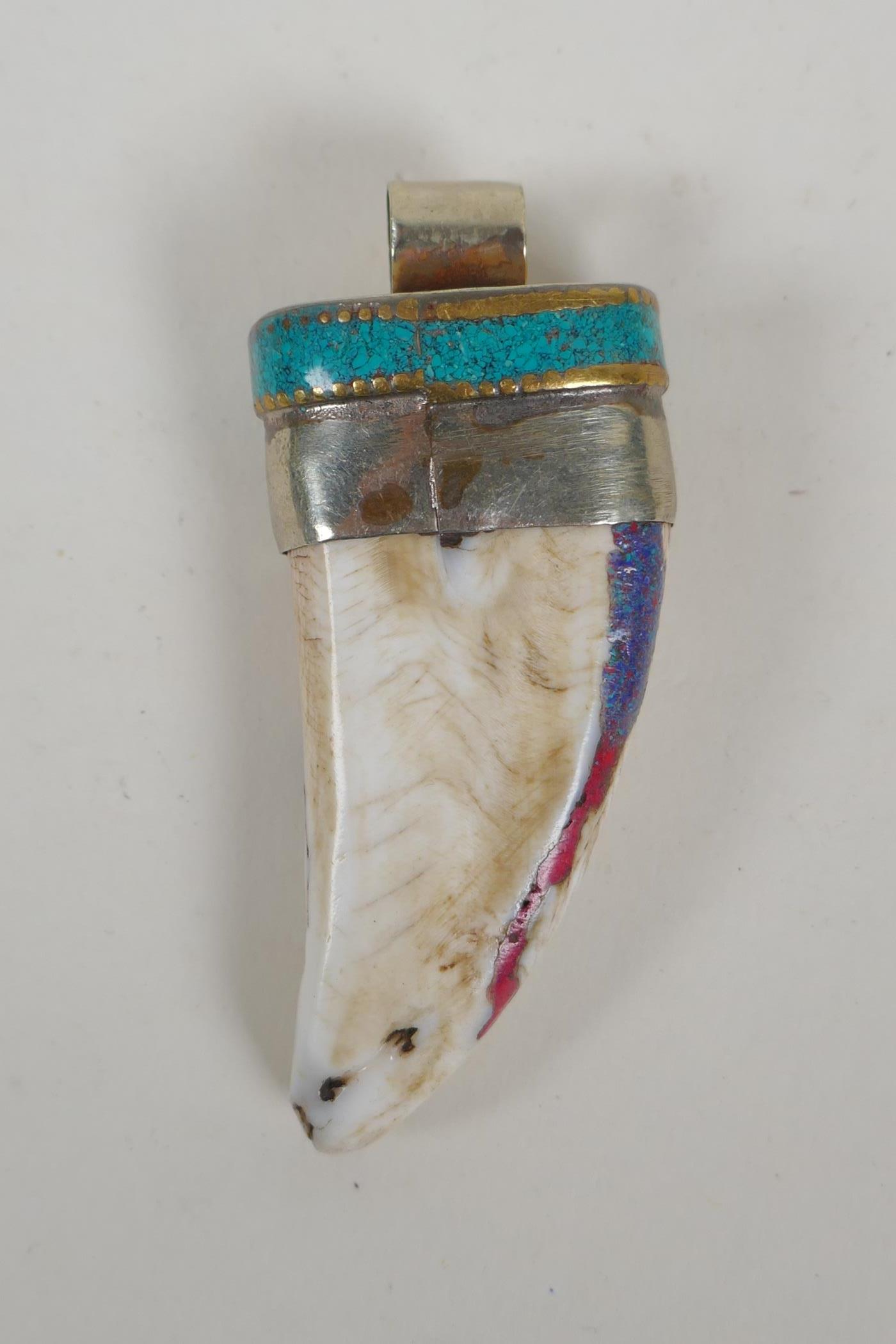 A Tibetan white metal mounted tooth pendant with enamel details, 7cm - Image 2 of 2