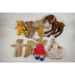 A collection of vintage plush toys, including a Bambi deer, three rabbits and four antique teddy