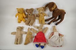 A collection of vintage plush toys, including a Bambi deer, three rabbits and four antique teddy