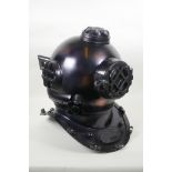 A decorative antiqued copper and brass 'US Naval Diving Helmet', 42cm high