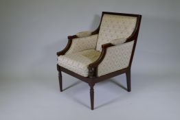 A French style walnut show frame armchair, raised on fluted turned supports, C20th