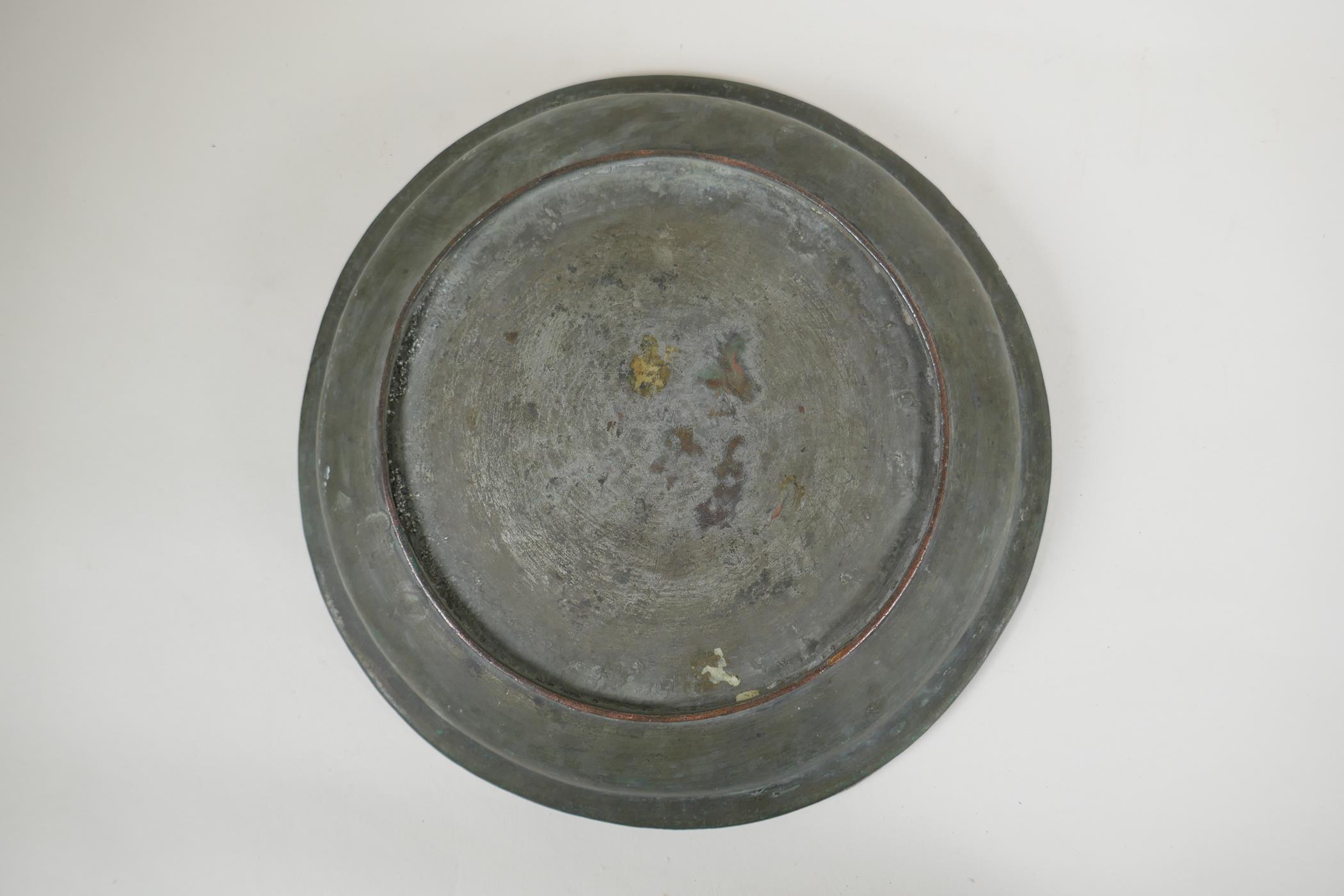 An antique Islamic copper dish with chased script and floral decoration, 34cm diameter - Image 3 of 3
