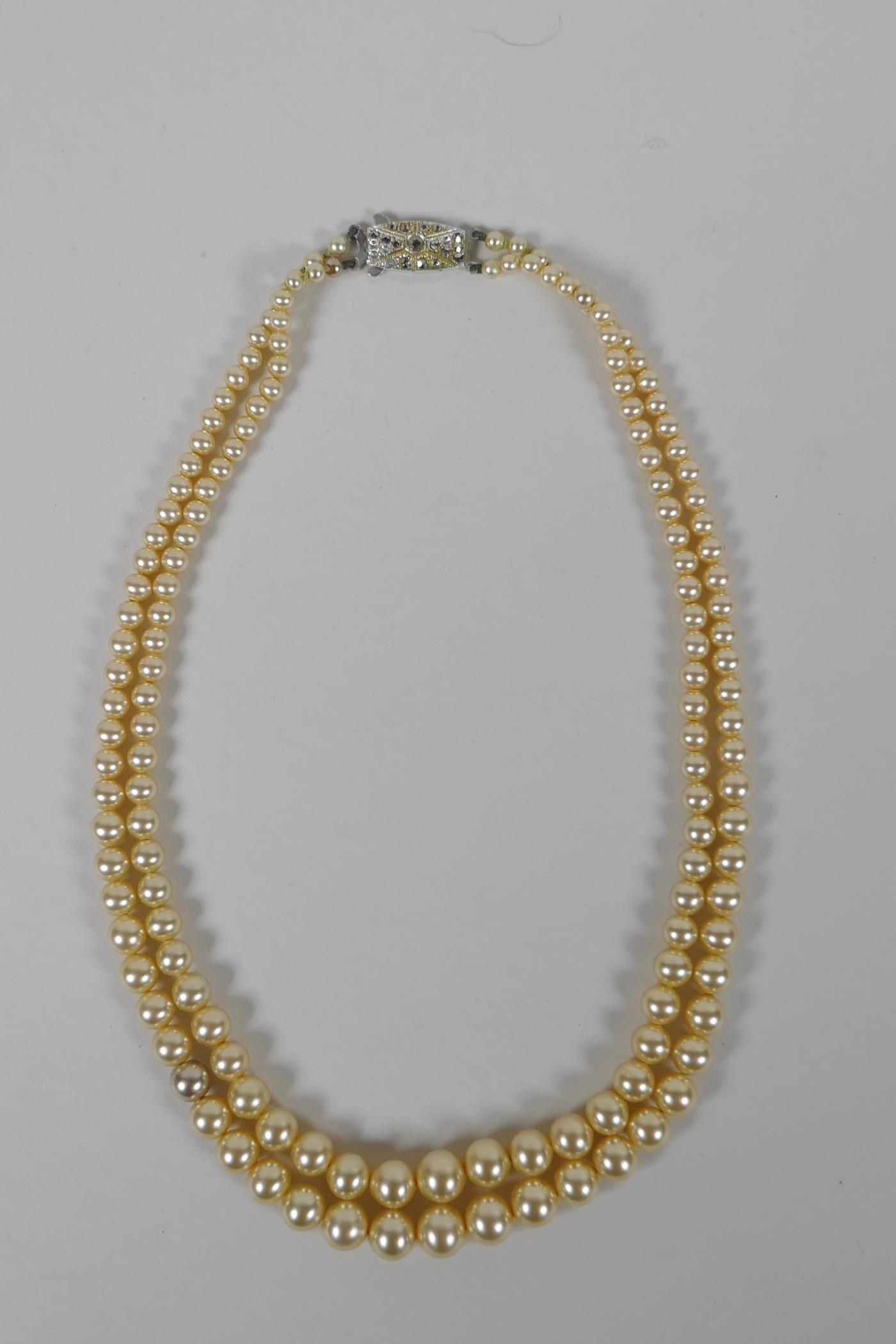 A vintage graduated faux pearl twin strand necklace, 38cm long