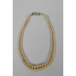 A vintage graduated faux pearl twin strand necklace, 38cm long