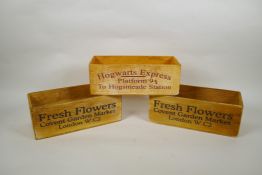 A pair of wooden 'Covent Garden' flower trays and a 'Harry Potter Hogwarts Express' tray